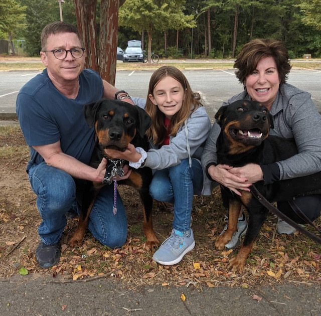 Me, my wife and daughter with our 2 Rottweilers